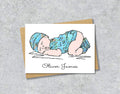 Greeting card with textile illustration of a baby boy with personalised text.