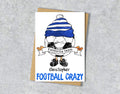 Greeting card with a cartoon character wearing a blue and white striped hat, text 'Favourite team Christopher' and 'FOOTBALL CRAZY' 
