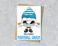 Greeting card with a cartoon character wearing a sky blue and white striped hat, text 'Favourite team Christopher' and 'FOOTBALL CRAZY' 