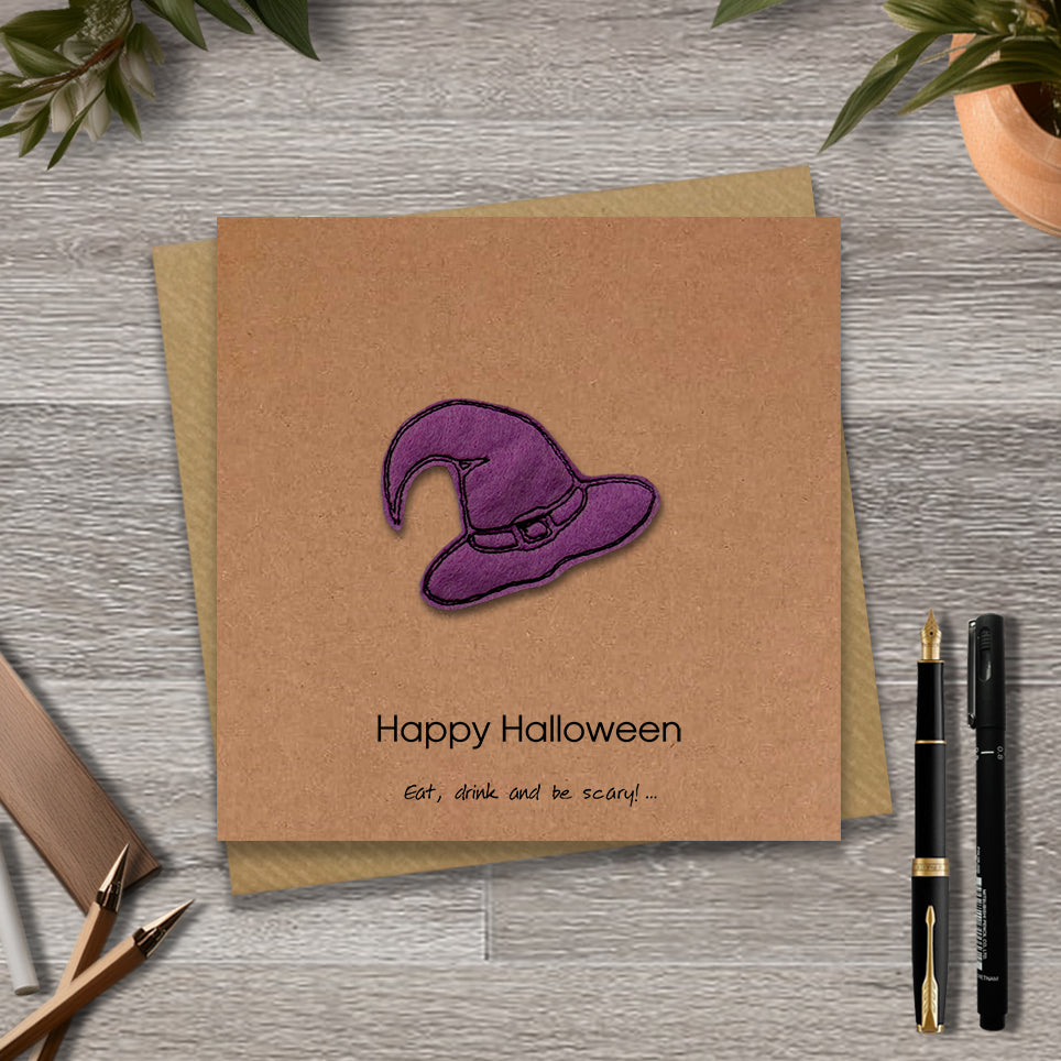 Kraft Halloween card with a embroidered purple witches hat design and text