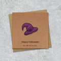 Kraft Halloween card with a embroidered purple witches hat design and text