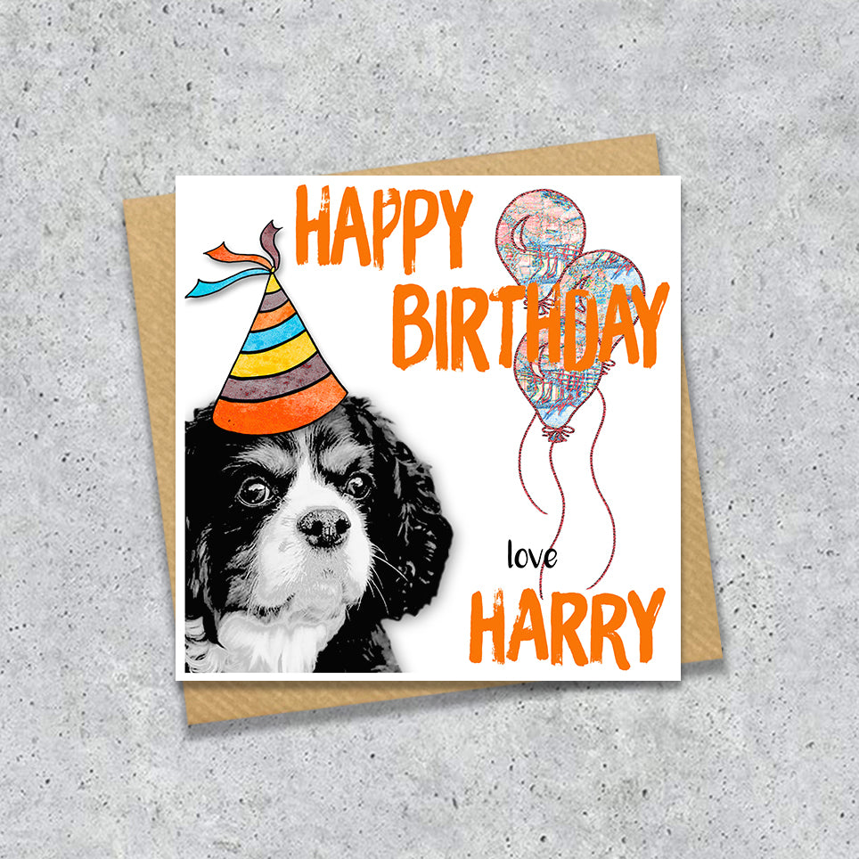 Birthday card with a King Charles Spaniel wearing a party hat and balloons, with personalised text.