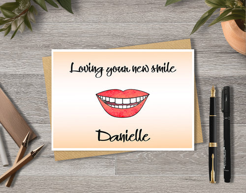 Greeting card with a smiley mouth illustration saying 'Loving your new smile' with personalised text.
