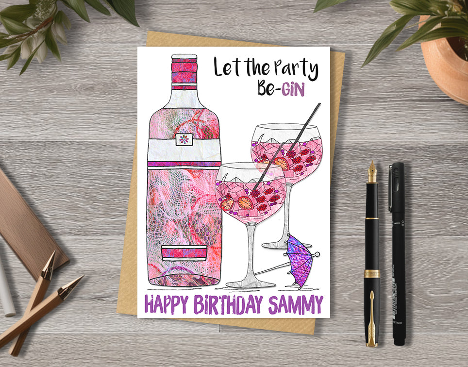 Birthday card with a colorful illustration of pink gin bottle and glasses and text 'Let the party be-gin'.