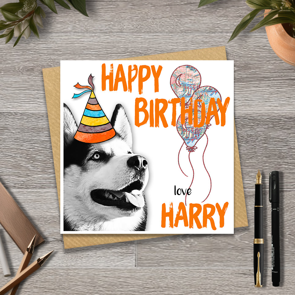 Birthday card with a Siberian husky wearing a party hat and balloons, with personalised text.