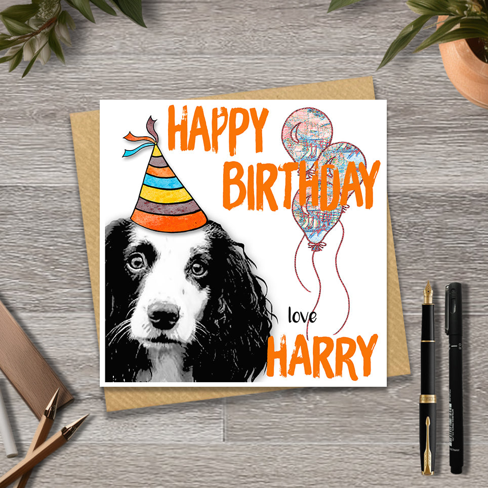 Birthday card with a Springer spaniel wearing a party hat and balloons, with personalised text.
