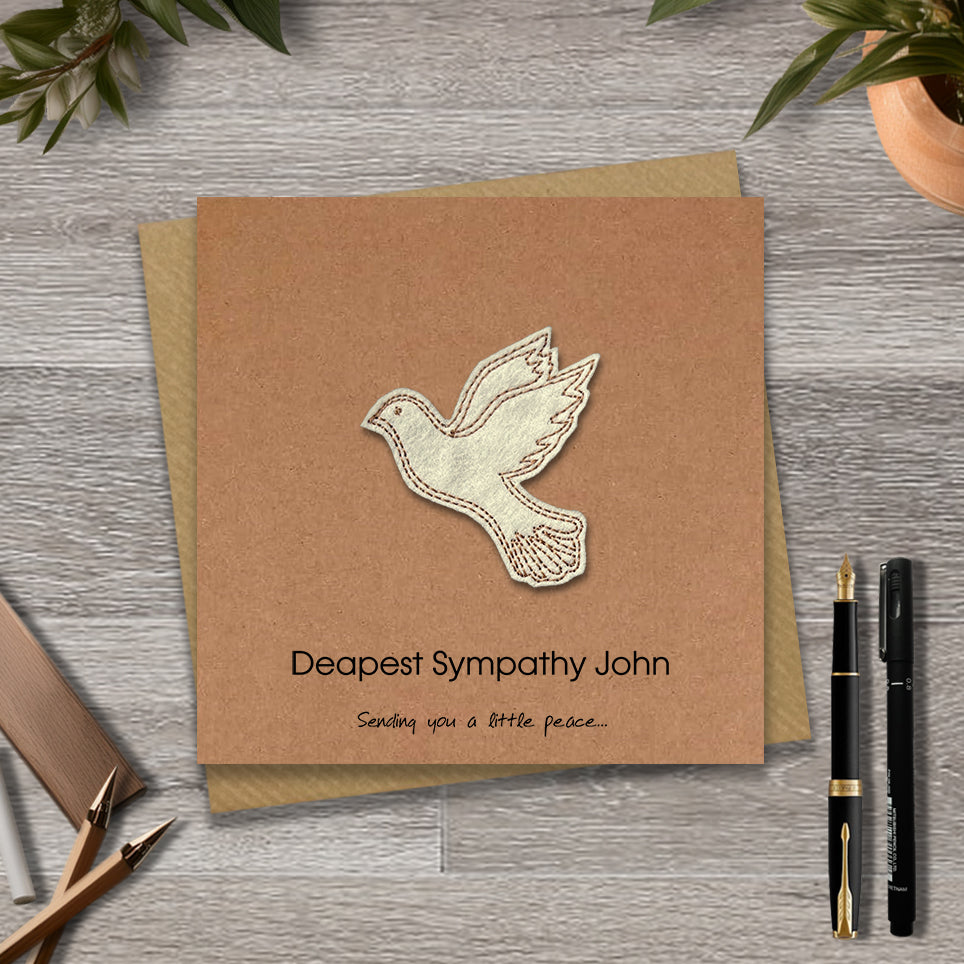 Kraft sympathy card with a embroidered dove design and personalised text