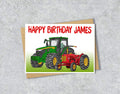 Birthday card with green and red tractors and 'Happy Birthday James' 