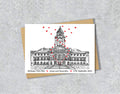 Wedding / Anniversary card with a black and white textile illustration of Wallasey Town Hall Wirral and red hearts with personalised text.