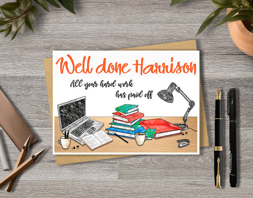 Greeting card with 'Well done Harrison' text and a illustration of a desk with books, laptop, and lamp.